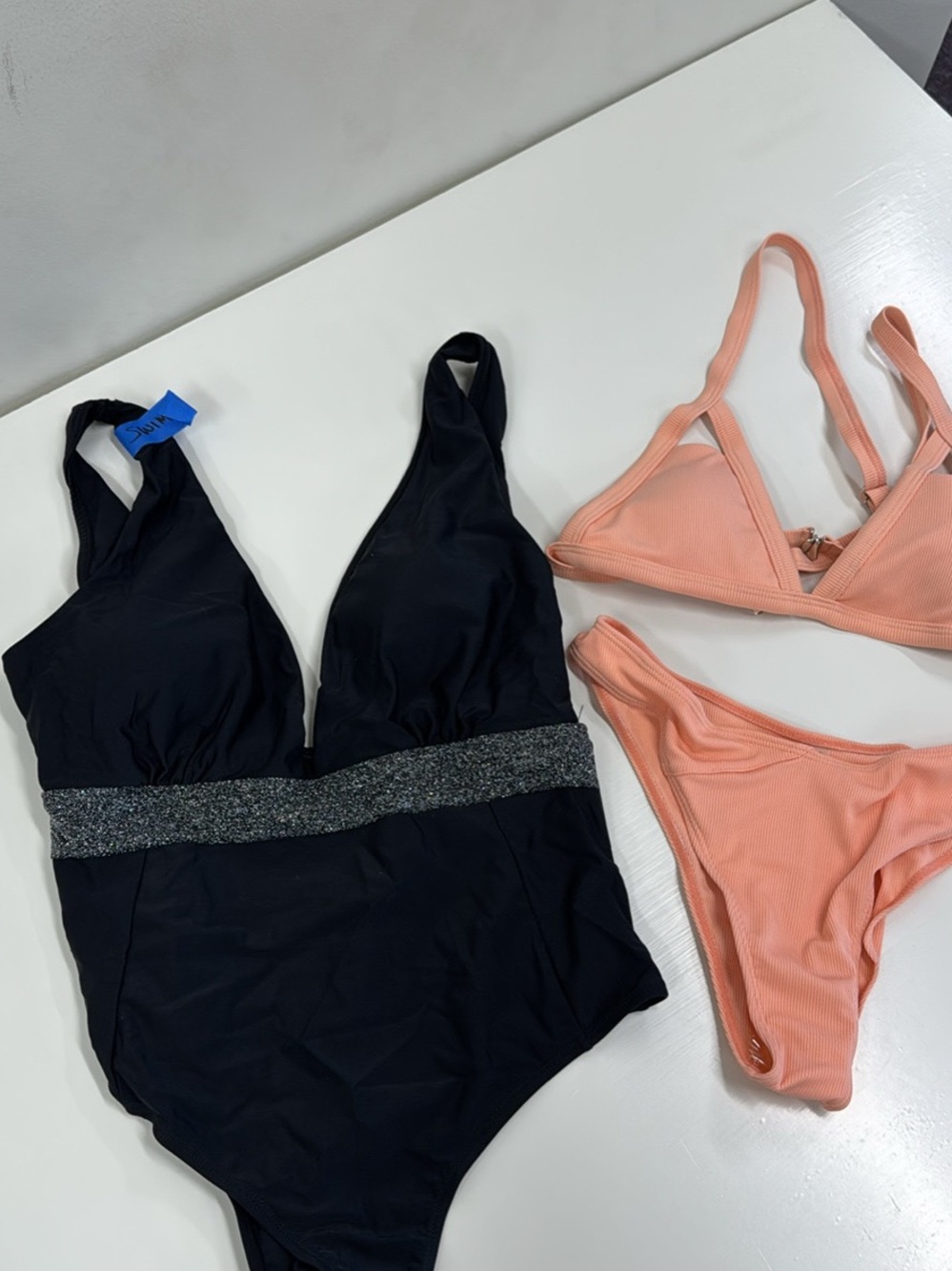 New Lot of 2 M- Black One-Piece Swimsuit with Waistband and a peach bikini set.